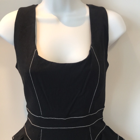Bebe mechanical fabric peplum dress. - Picture 2 of 11